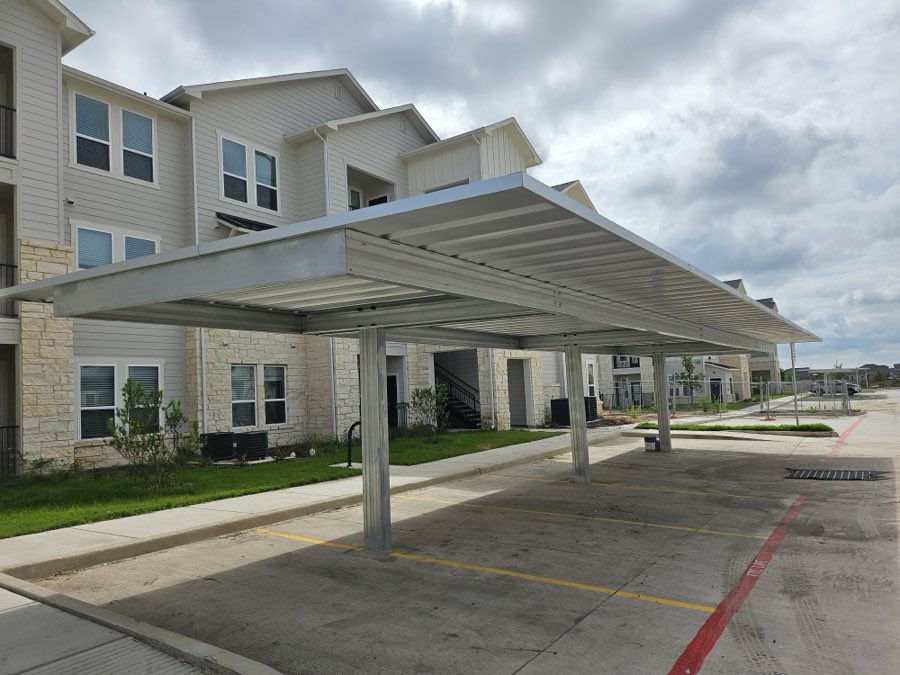 Galvanized cantilever carport at an apartment community
